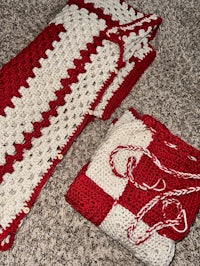 a red and white crocheted blanket