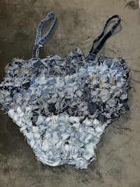 a bag made out of blue and white denim