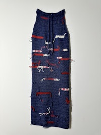 a knitted skirt with red, white and blue threads