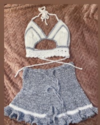 a crocheted bikini set on a bed